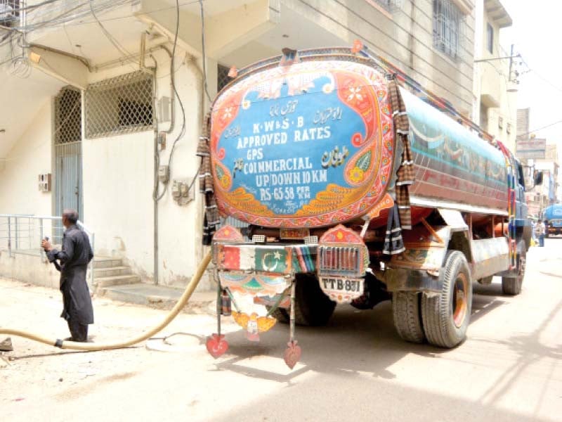 a private water tanker supplies water to residents of akhtar colony where acute water shortage is being witnessed photo jalal qureshi express