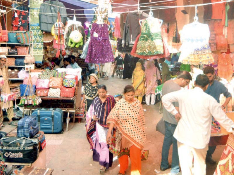 people busy in shopping in the bohri bazaar area of karachi on monday following relaxation of covid lockdown photos express