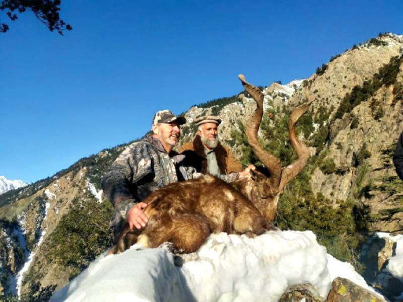 two men pose for a photo after hunting a markhor in upper kohistan photo express