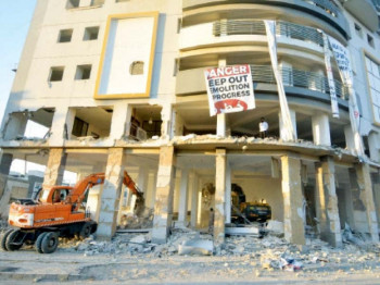 workers use heavy machinery to demolish nasla tower on supre court orders photo jalal qureshi express
