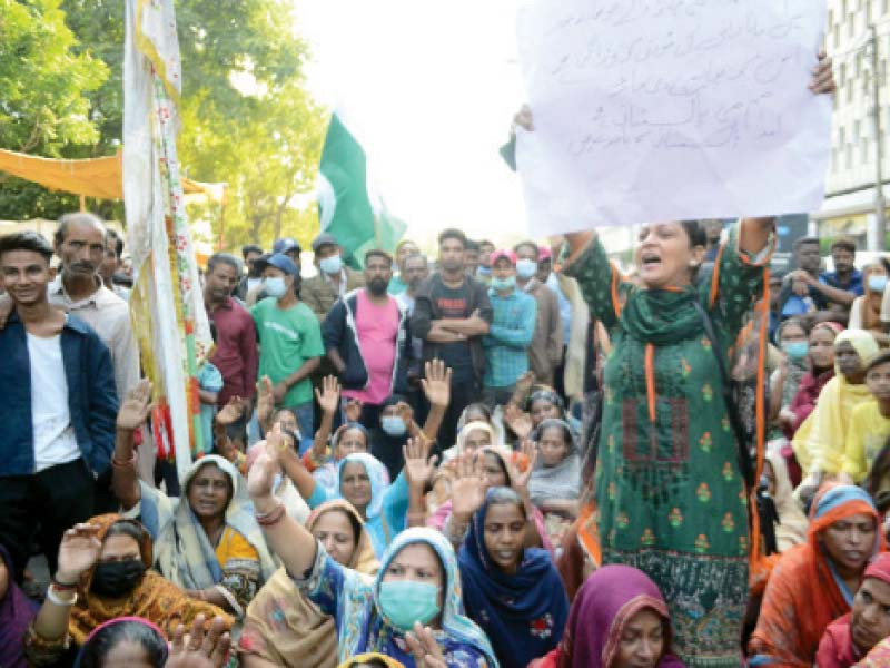 residents of narainpura minorities compound stage a protest in front of karachi press club on tuesday photo ppi