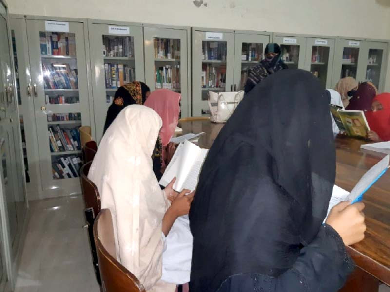 readers engrossed in books at a library in sita road dadu photo express