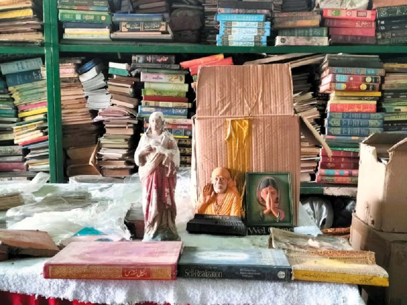 anjuman tahaffuz muqaddas auraq head haji qasim and a volunteer pack worn out copies and torn pages of the holy quran and relgious books for burial at sea while books and artifacts of other religions are also ready for packing photos express