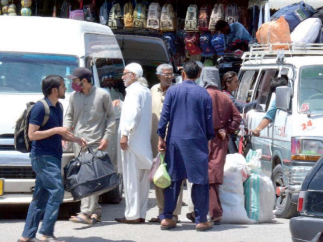 passengers board buses and vans at faizabad to depart for their hometowns to celebrate eid with their loved ones photo inp passengers board buses and vans at faizabad to depart for their hometowns to celebrate eid with their loved ones photo inp