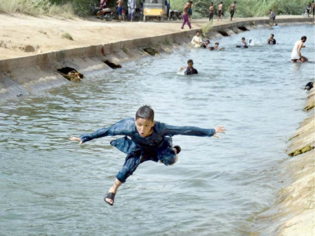 a boy jumps into a channel of the hub canal which supplies water to karachi from balochistan photo online a boy jumps into a channel of the hub canal which supplies water to karachi from balochistan photo online