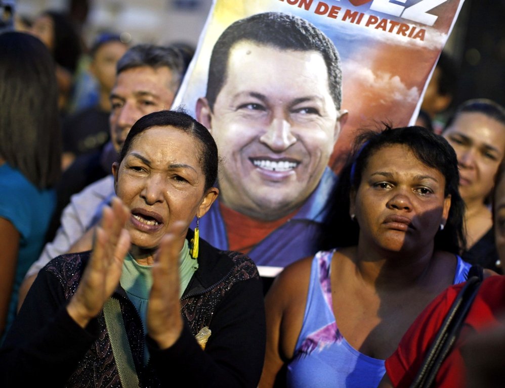 supporters of venezuela 039 s president hugo chavez react to the announcement of his death in caracas photo reuters