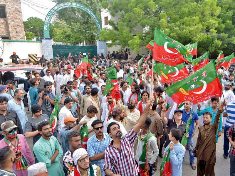 pti supporters stage a protest outside the ecp office in karachi over postponement of the local government elections photo jalal qureshi express