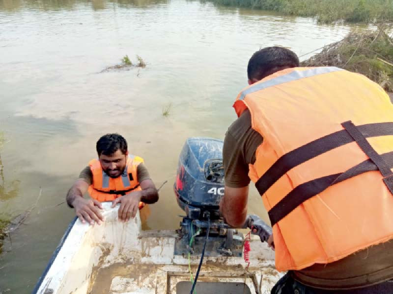 rescue workers continue search operations in dera ghazi khan around 120 of them are participating in relief work amid monsoon rains and floods photo express