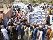 locals line up near a truck to get flour at the official rate in quetta amid a shortage of the commodity photo inp locals line up near a truck to get flour at the official rate in quetta amid a shortage of the commodity photo inp