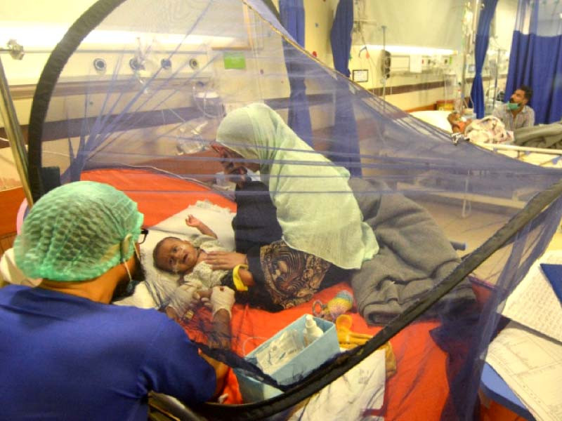 a doctor treats a child at the dengue ward of the sindh infectious diseases hospital and research centre karachi photo express