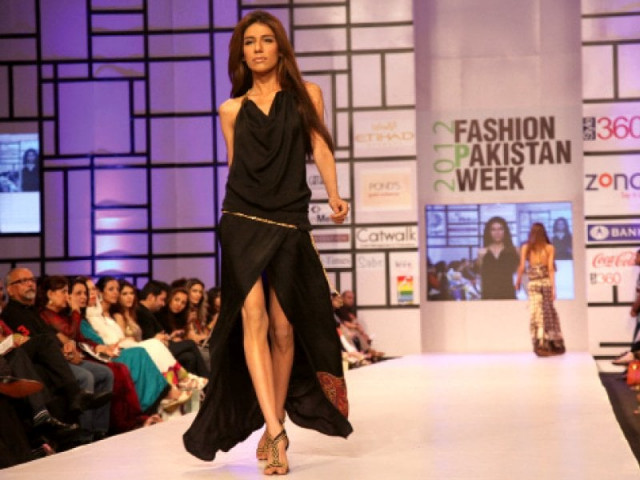 a model walks the runway at fpw 2012 a model walks the runway at fpw 2012