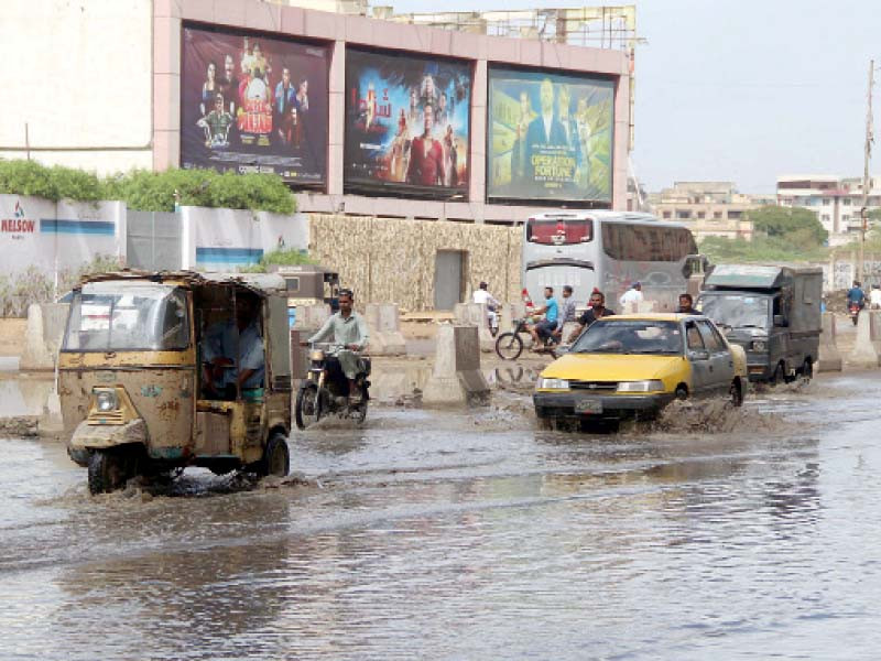 motorists face difficulty due to water accumulated on the ma jinnah road following rainfall in karachi photo online