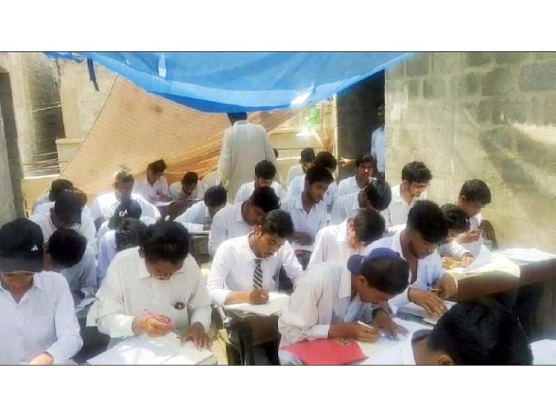 students solve their ssc annual exam paper at a makeshift centre in karachi on tuesday photo express