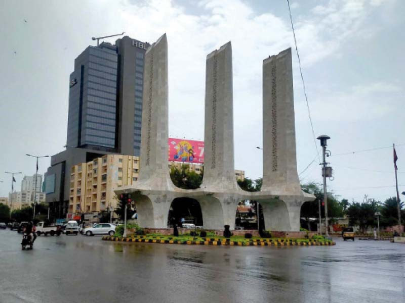 the road at teen talwar intersection got wet after a brief drizzle on monday afternoon photo inp