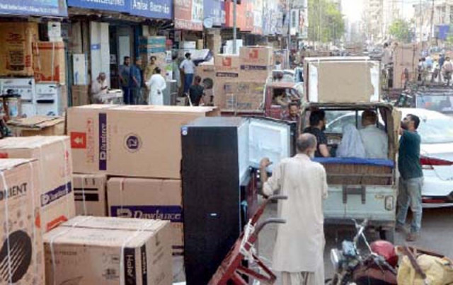 deep freezers bought by customers for keeping sacrificial meat are piled up outside the showrooms at regal chowk for delivery photo jalal qureshi express deep freezers bought by customers for keeping sacrificial meat are piled up outside the showrooms at regal chowk for delivery photo jalal qureshi express