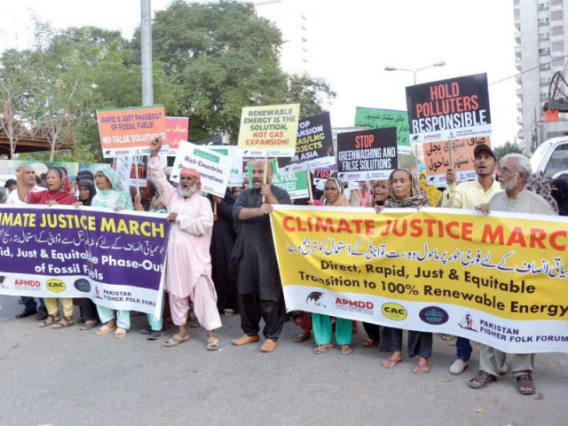 activists hold a climate justice march outside the karachi press club on friday photo express activists hold a climate justice march outside the karachi press club on friday photo express