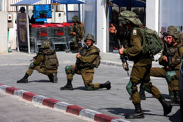 Israeli soldiers work to secure residential areas following a mass-infiltration by Hamas gunmen from the Gaza Strip, in Sderot, southern Israel October: Reuters