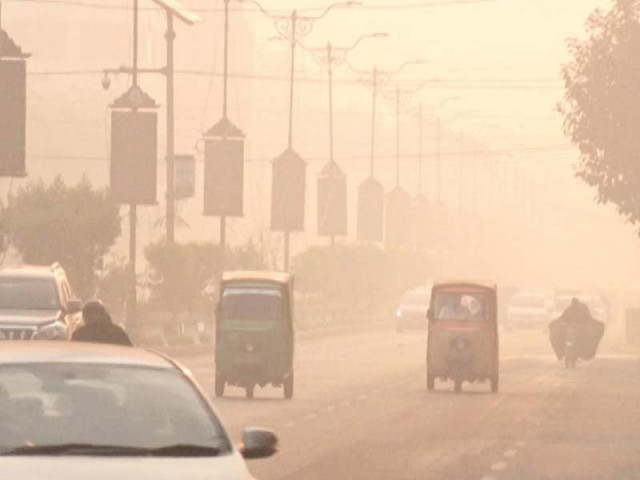 despite the advisory by the government urging people to stay indoors traffic appears to plying a road engulfed by smog photo abid nawaz express despite the advisory by the government urging people to stay indoors traffic appears to plying a road engulfed by smog photo abid nawaz express