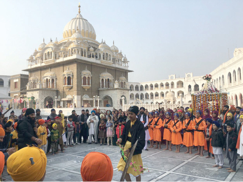 members of the sikh community perform traditional rituals as part of the 358th birth anniversary celebrations of guru gobind singh at gurdwara sri panja sahib in hasan abdal photo express
