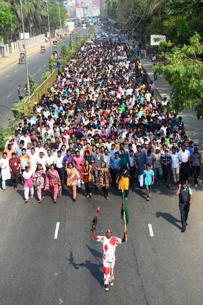 bangladesh awami league activists march against a strike called by the bangladesh nationalist party bnp in dhaka on march 7 2013