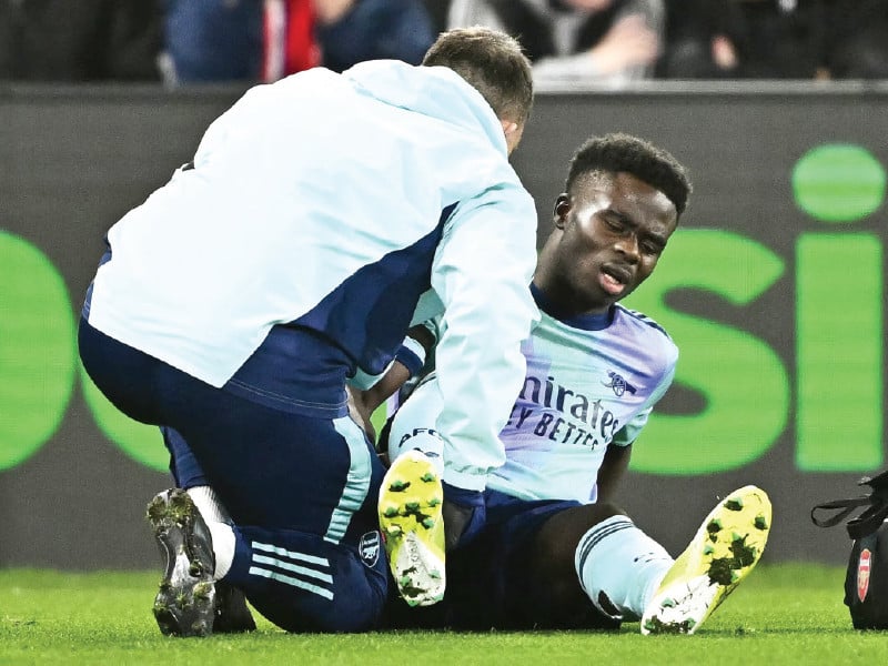 arsenal s bukayo saka receives medical attention after sustaining an injury photo reuters