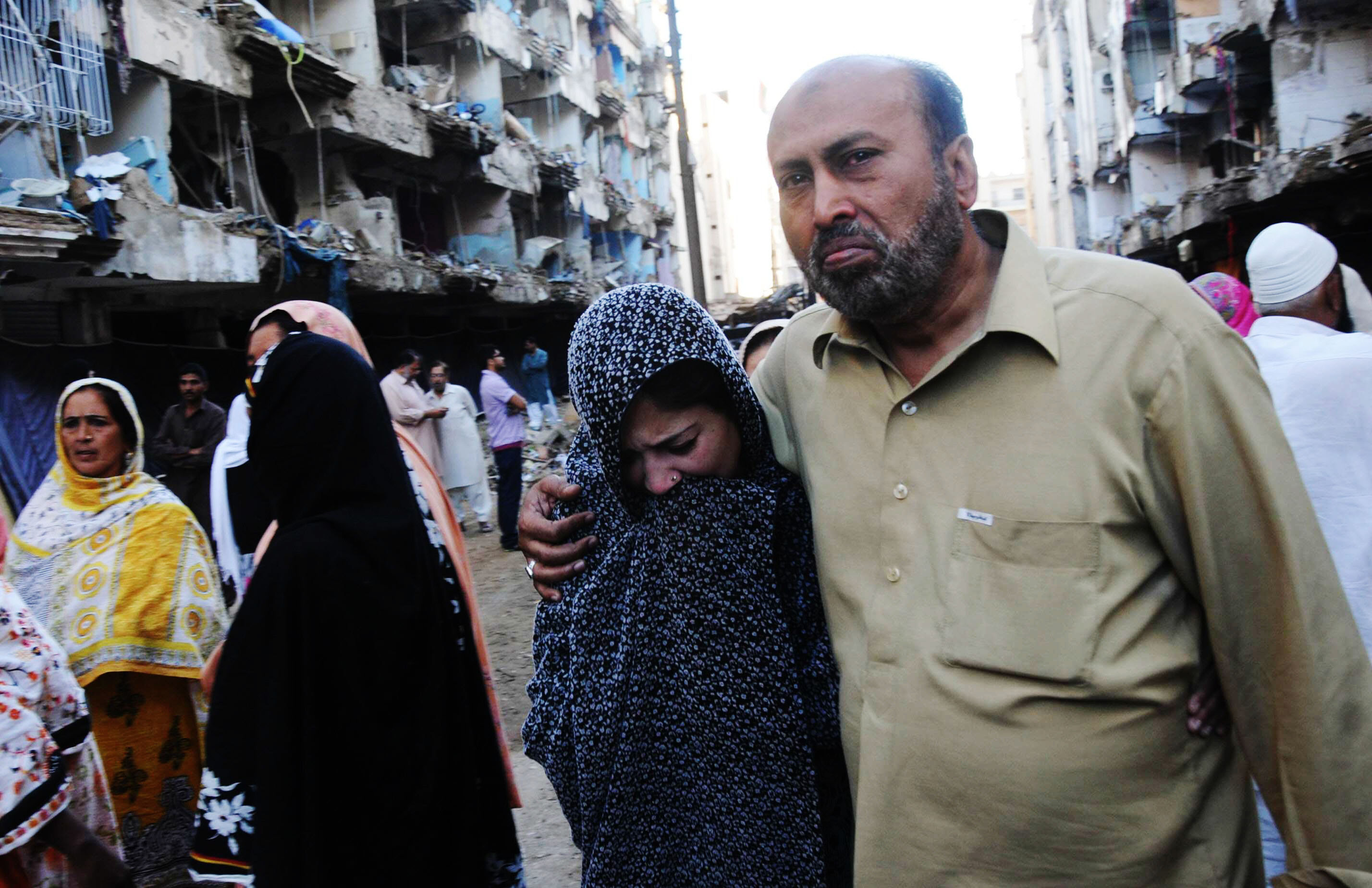 a woman is consoled after the abbas town twin blasts photo rashid ajmeri express file