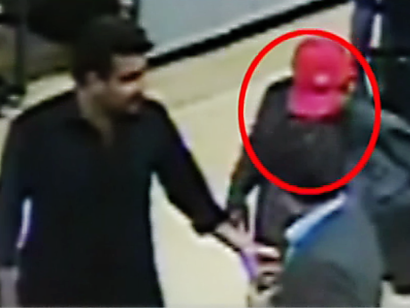 a screen grab from the cctv footage that shows shahrukh jatoi being escorted through karachi airport photo express