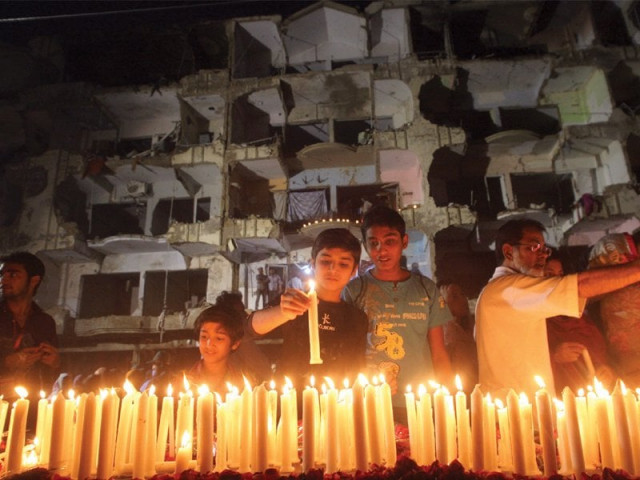 friends families and supporters light candles at the site of the blast on friday in memory of the 50 people who lost their lives in the attack photo athar khan express friends families and supporters light candles at the site of the blast on friday in memory of the 50 people who lost their lives in the attack photo athar khan express