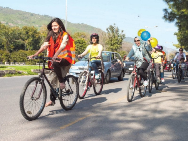 turning many heads women in their colourful helmets and neon balloons stringed to their bikes were cycling for a cause photo online express turning many heads women in their colourful helmets and neon balloons stringed to their bikes were cycling for a cause photo online express