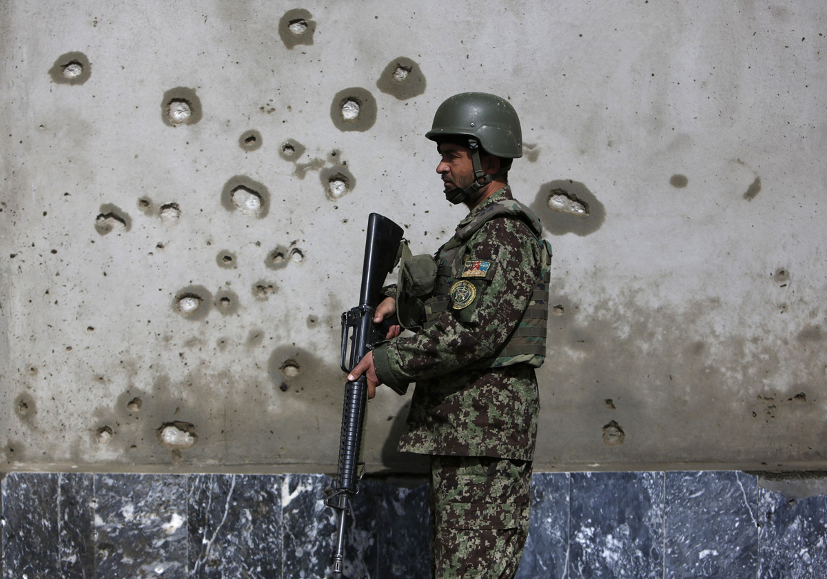 n afghan national army soldier keeps watch near the site of an attack in kabul march 9 2013 photo reuters