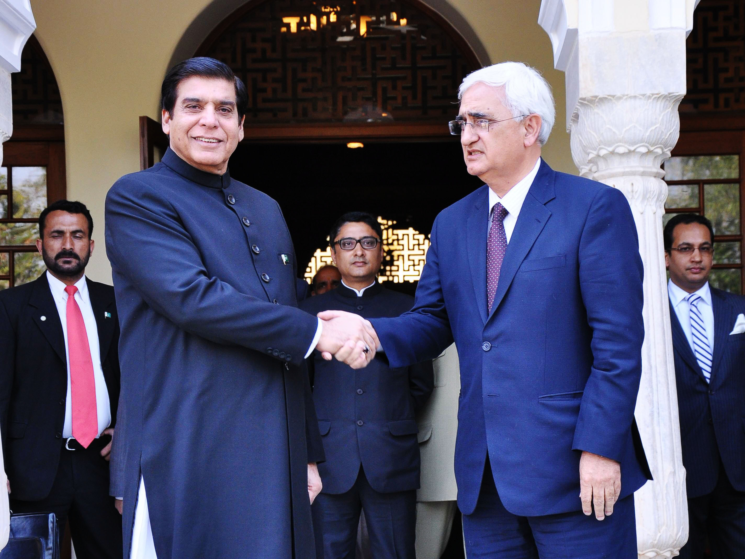 prime minister raja pervez ashraf r shakes hands with indian foreign minister salman khurshid at a hotel in jaipur march 9 2013 photo afp