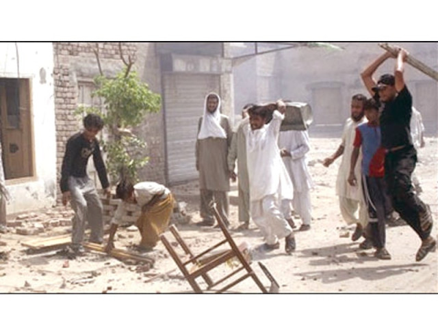 rioters in gojra ran amok over rumours of desecration of the holy quran photo express file rioters in gojra ran amok over rumours of desecration of the holy quran photo express file