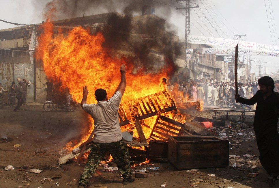 demonstrators burn furniture during a protest in the badami bagh area of lahore march 9 2013 photo reuters