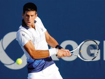 indian wells atp djokovic through after tough opener