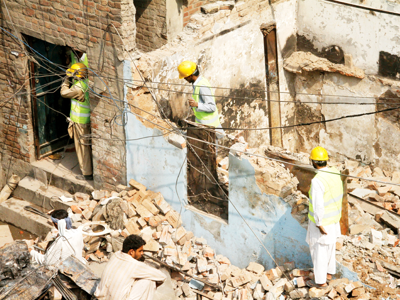 three days deadline set for repair of homes more cheques to be distributed today photo abid nawaz express