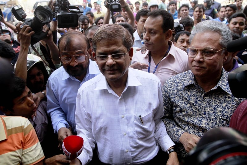 bangladesh nationalist party bnp acting secretary general mirza fakhrul islam alamgir c bnp vice chairman and former dcc mayor sadeque hossain khoka l and former home minister altaf hossain chowdhury r are seen at party headquarters after their release from police custody photo afp