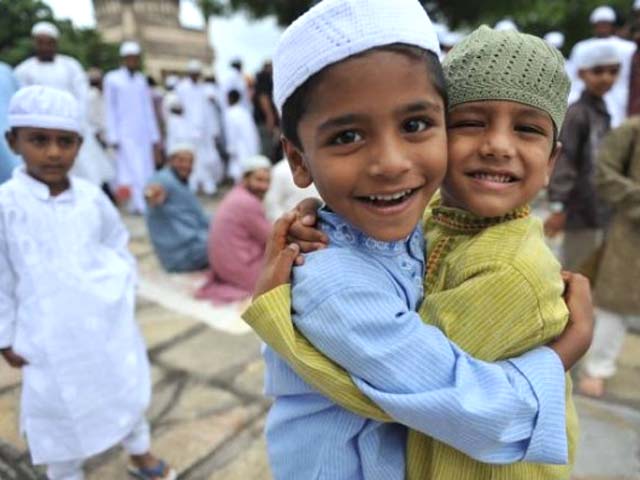 muslim children greet after eid al fitr prayers at the qutub shahi tomb photo afp