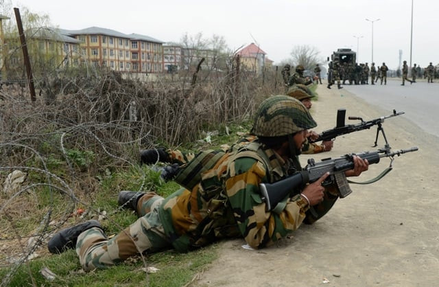 indian soldiers take positions outside a school after an attack against indian paramilitary personnel in srinagar on march 13 2013 photo afp indian soldiers take positions outside a school after an attack against indian paramilitary personnel in srinagar on march 13 2013 photo afp