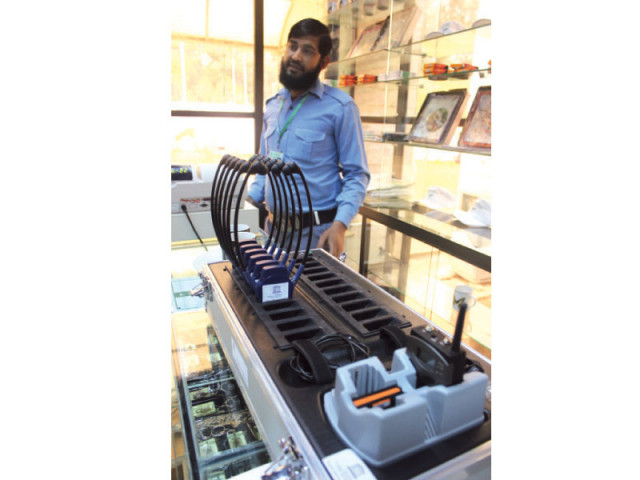 the equipment consists of one walkie talkie like transmitter and eight headsets photo waqas naeem express the equipment consists of one walkie talkie like transmitter and eight headsets photo waqas naeem express