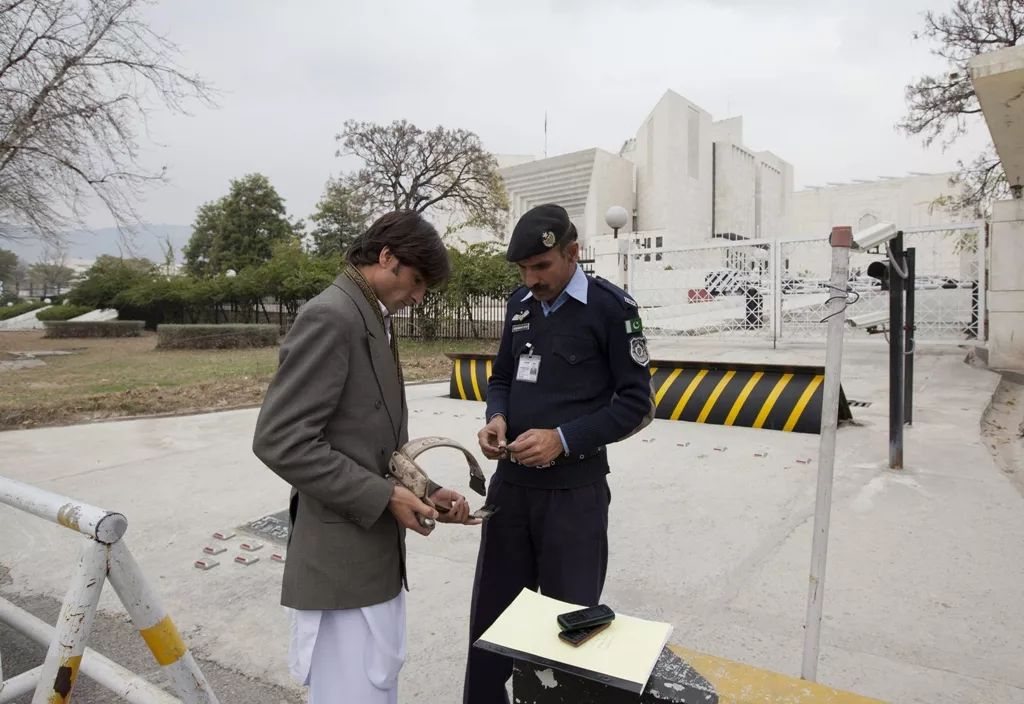 mohammed afzal who petitioned for a reinvestigation into alleged death sentences a kohistan jirga imposed is searched by a policeman as he arrives at the supreme court on february 14 2013 photo reuters mohammed afzal who petitioned for a reinvestigation into alleged death sentences a kohistan jirga imposed is searched by a policeman as he arrives at the supreme court on february 14 2013 photo reuters