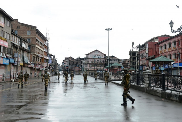 indian paramilitary soldiers patrol during a curfew imposed on the kashmiri summer capital in srinagar on march 14 2013 photo afp indian paramilitary soldiers patrol during a curfew imposed on the kashmiri summer capital in srinagar on march 14 2013 photo afp