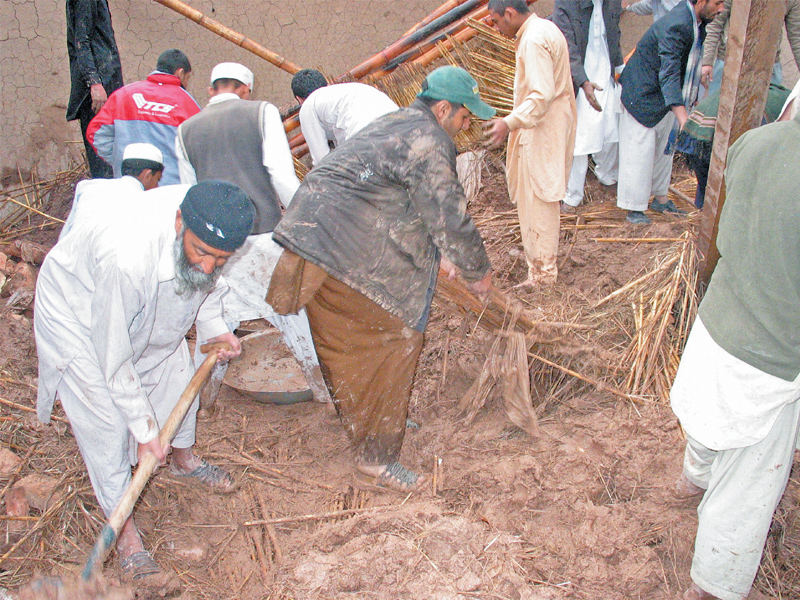 rescue workers clear rubble after a roof collapsed in bihari colony peshawar killing two minors and injuring their parents photo muhammad iqbal express