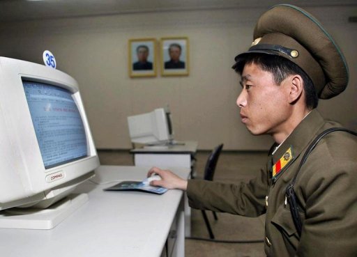 a north korean soldier seen using a computer in pyongyang on march 28 2002 photo afp