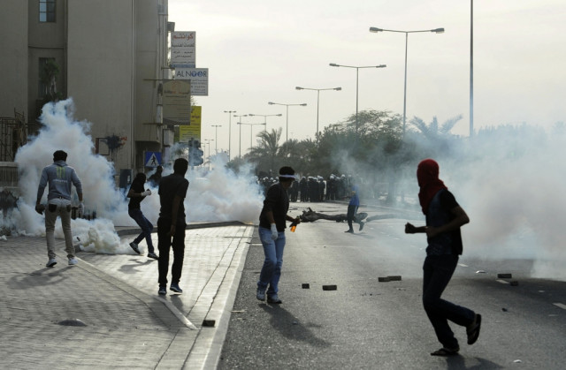 protesters clash with riot police in the village of sanabis west of manama march 14 2013 photo reuters protesters clash with riot police in the village of sanabis west of manama march 14 2013 photo reuters