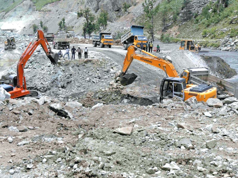 excavators dig up earth at the site of kishanganga power project north of srinagar photo file