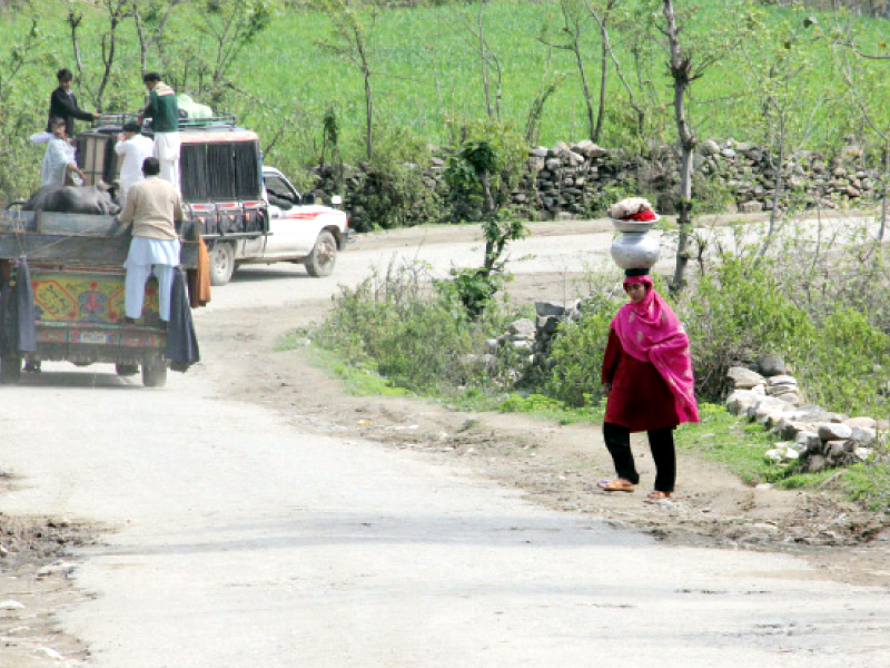 people have to travel four kilometres for water and carry it on their shoulders photo express