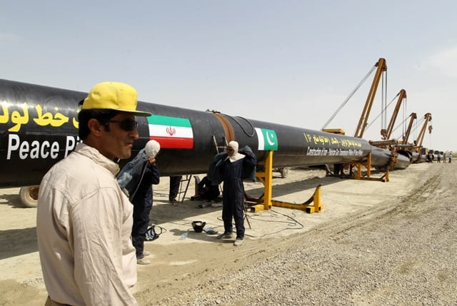 iranians work on a section of a gas pipeline linking iran and pakistan after the project was launched during a ceremony in the iranian border city of chah bahar on march 11 2013 photo afp