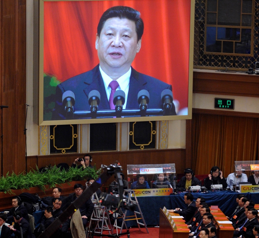 china 039 s newly elected president xi jinping is shown on a huge screen as he delivers his maiden speech at the closing session of the national people 039 s congress npc at the great hall of the people in beijing on march 17 2013 photo afp