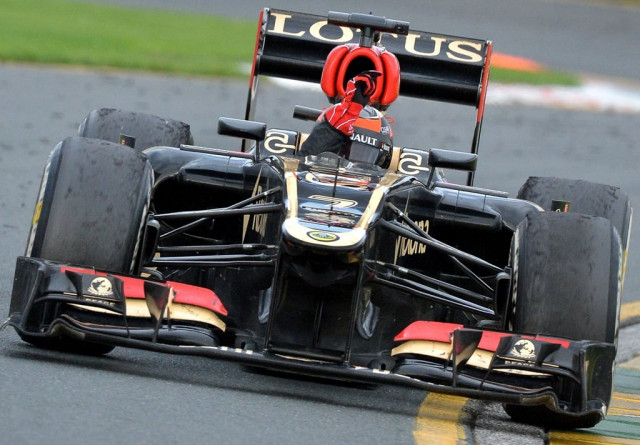 lotus driver kimi raikkonen of finland gestures as he takes a victory lap after winning the formula one australian grand prix in melbourne on march 17 2013 photo afp lotus driver kimi raikkonen of finland gestures as he takes a victory lap after winning the formula one australian grand prix in melbourne on march 17 2013 photo afp