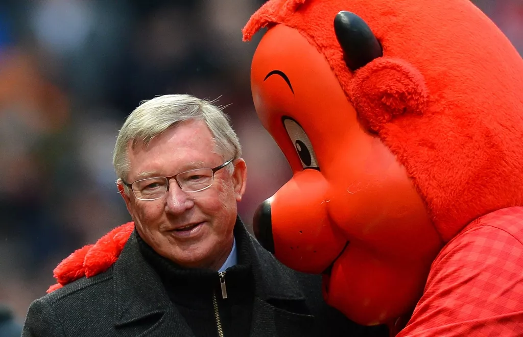 manchester united manager alex ferguson l is hugged by mascot fred the red as he makes his way to the bench before the english premier league football match between manchester united and reading at old trafford in manchester north west england on march 16 2013 photo afp manchester united manager alex ferguson l is hugged by mascot fred the red as he makes his way to the bench before the english premier league football match between manchester united and reading at old trafford in manchester north west england on march 16 2013 photo afp